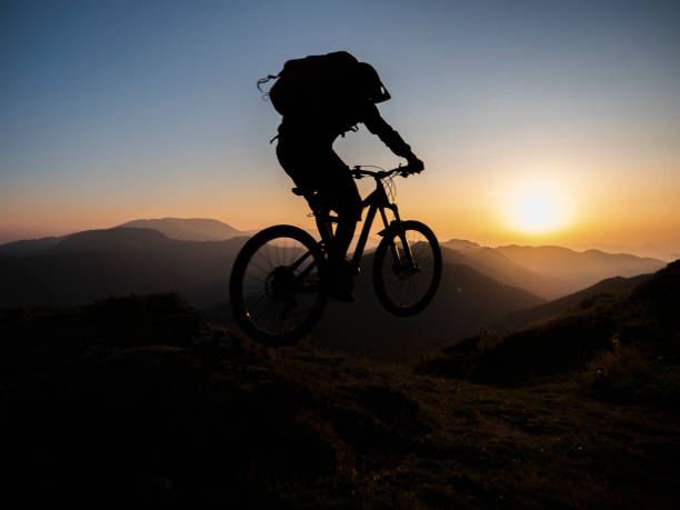 istock Mountain biker riding downhill in mountain. 1168532202