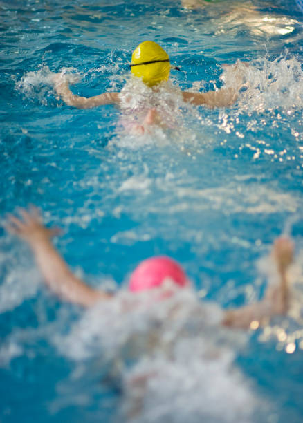 istock kids swimming in the pool 116853271