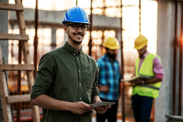 istock Portrait of group of engineers and architects on construction site 1168533685