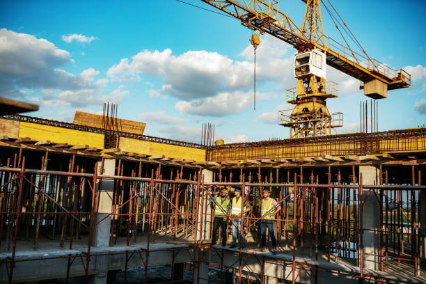 istock Photo of large scale construction site with engineers and manual workers 1168533836