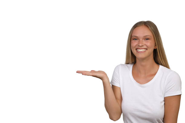 istock Young pretty woman laughs into the camera and points to an open space 1168534915