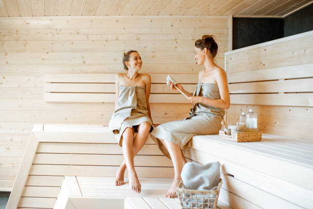 istock Two girlfriends relaxing in the sauna 1168535608