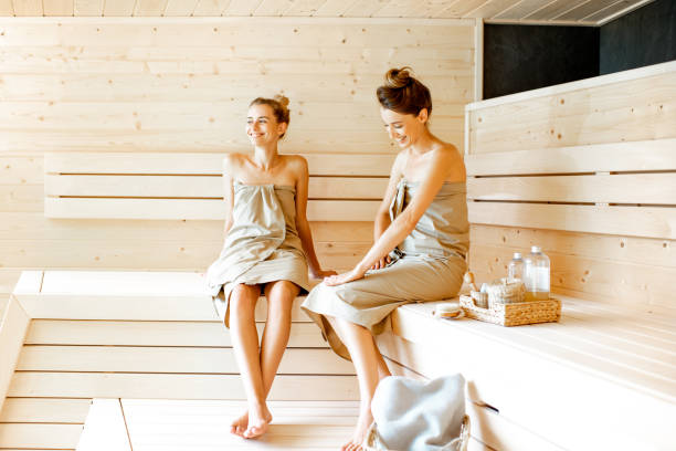 istock Two girlfriends relaxing in the sauna 1168535610