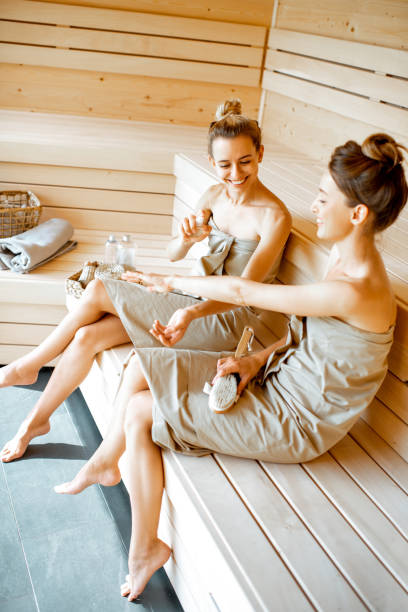 istock Two girlfriends relaxing in the sauna 1168535649