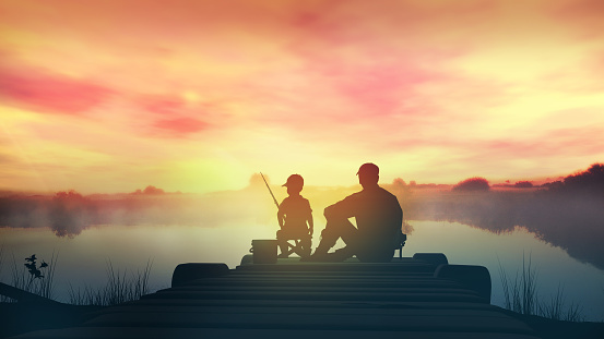 Father and son catch fish from a wooden pier at sunrise.