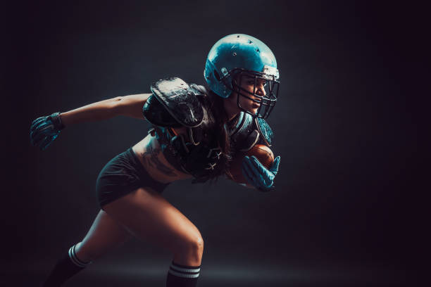 istock Aggressive sportswoman playing rugby 1168539011