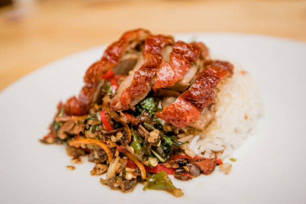 istock stir-fried roasted duck and basil and fried egg with rice, Thai food 1168539316