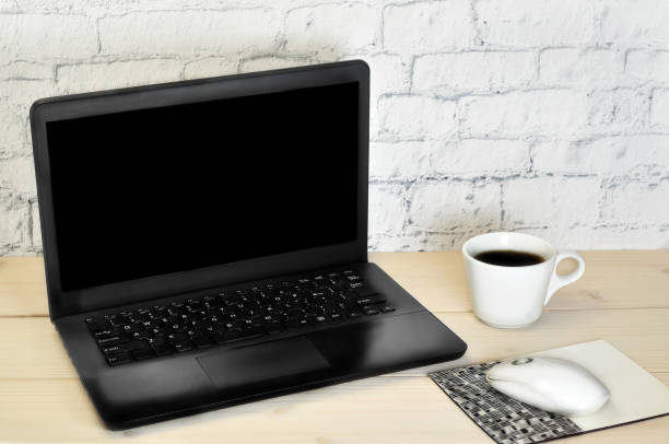 istock P.C.and A Cup of Coffee on the Table 1168540324