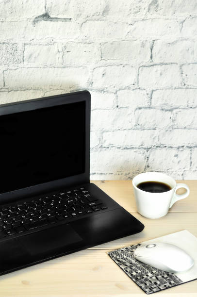 istock P.C.and A Cup of Coffee on the Table 1168540357