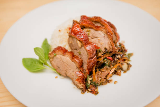 istock stir-fried roasted duck and basil and fried egg with rice, Thai food 1168541735