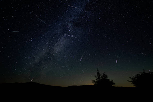 Perseid meteor shower Peak activity of the Perseid meteor shower. meteor shower stock pictures, royalty-free photos & images