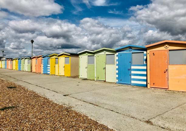 istock Colorful Beach Huts On A Cloudy Day 1168543023