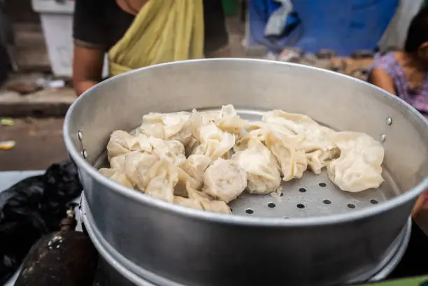 Steamed Chicken Momos displayed for Sale at Teretti bazaar, Kolkata. Momo is a type of South Asian dumpling.