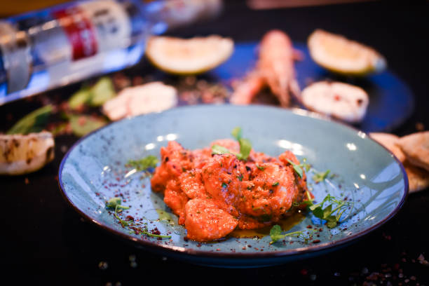istock saganaki receipt shrimps with fresh ingredients - seafood delight dish 1168545196