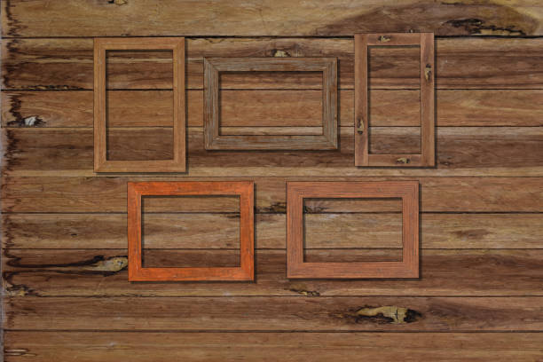 istock Vintage photo frames on wood wall for interior or background. 1168546651