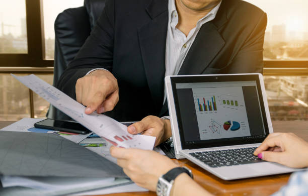 istock Business working graph analysis for executives city background 1168546716