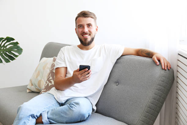 istock Young man with full beard chilling in his apatrment. 1168547481