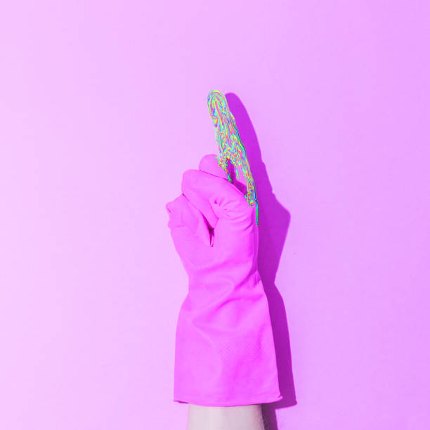 istock Iridescent shimmering liquid on the fingers. Rubber-gloved hand pointing upwards 1168548820