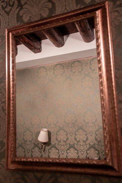 istock Venice Tipical interior of a hotel looking at lamp through the Mirror 1168549735