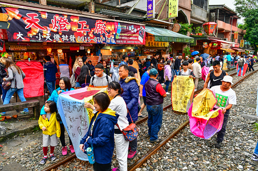 NewTaipei,Taiwan-Nov 23, 2018:Tourists are Launching Sky Lantern in Shifen is one of the most popular tourist attraction of people flock to the area for releasing the sky lantern with written prayers