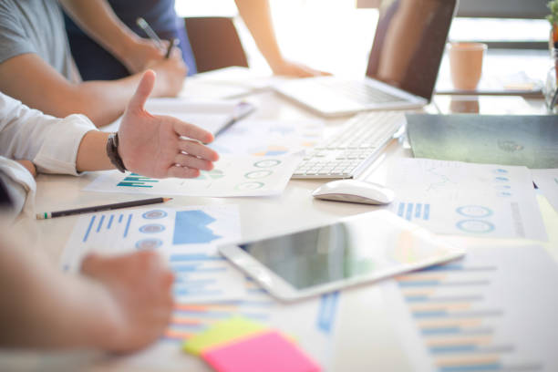 istock Business group or business partners discussing documents and ideas at meeting 1168550036