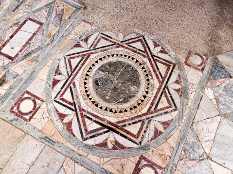 Particular of the polychrome opus sectile of the room with the three-light window in the Domus of Nymphaeum located archaeological excavations of Ostia Antica in Rome