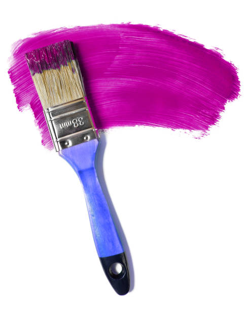istock Paintbrush with purple paint (isolated on white) 1168551730