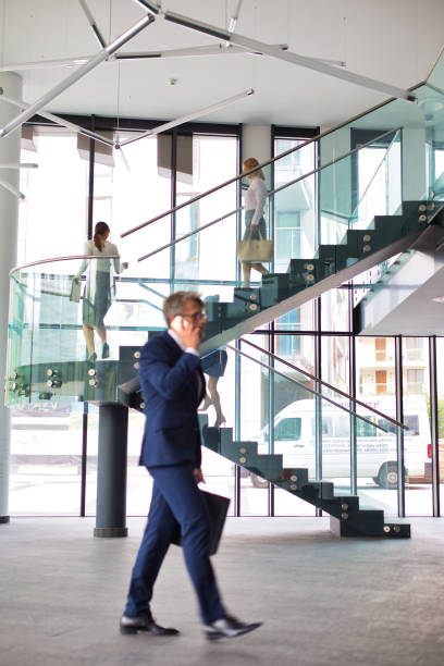 istock Businessman talking while walking at new office 1168552663