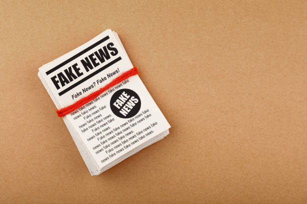 istock Stack of FAKE NEWS newspapers over brown paper 1168553903