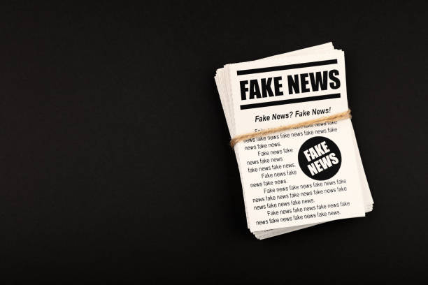 istock Stack of FAKE NEWS newspapers over black 1168553917