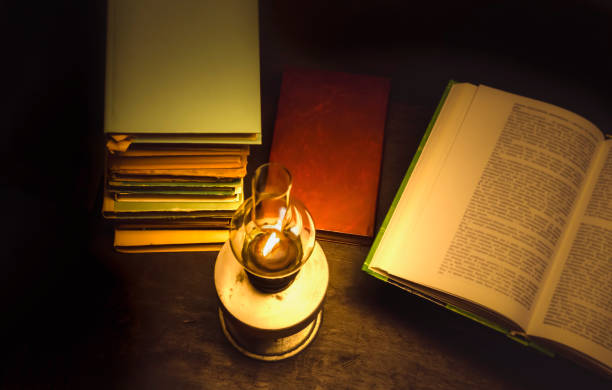 istock Old  books and a kerosene lamp. 1168557369
