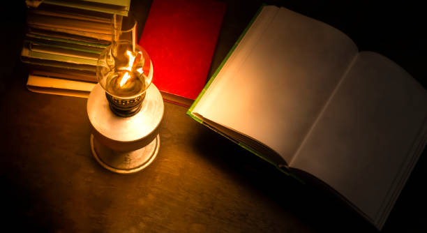 istock Old  books and a kerosene lamp. 1168557370