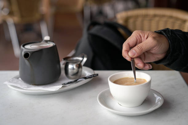 istock Stirring a cup of coffee with spoon 1168558365