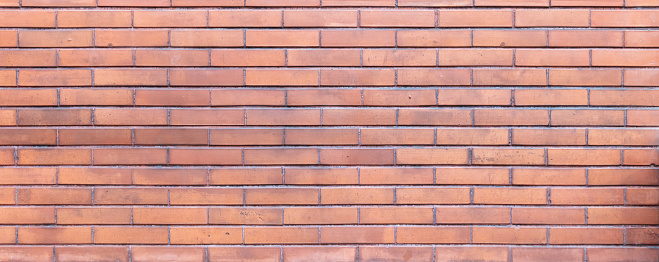 Brown red color brick wall texture, background. Traditional building facade