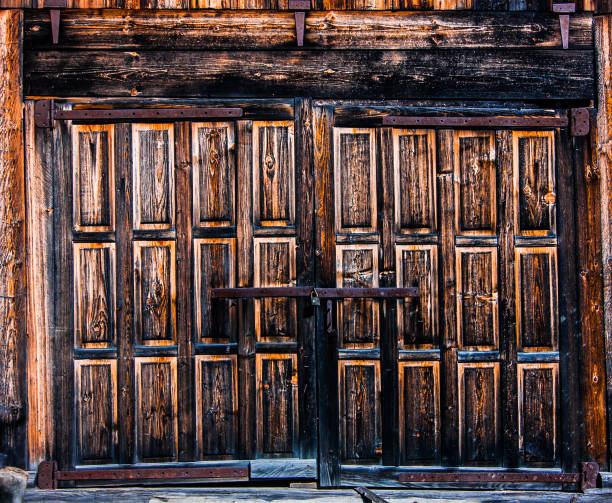 istock Big wooden gate with lock 1168563425
