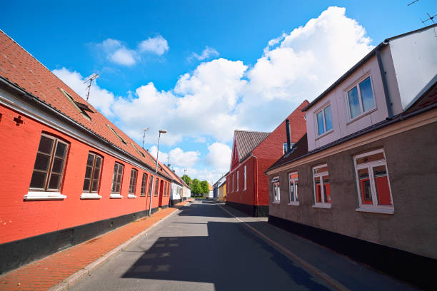 istock Empty street with red buildings 1168564772
