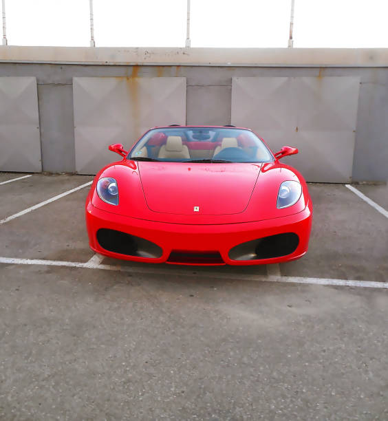 Athens Greece, February 06 2016: 06 2016: red ferrari car parked at a greek parking.