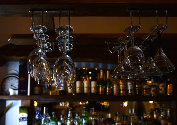 istock Glasses hang down over the bar 1168579881