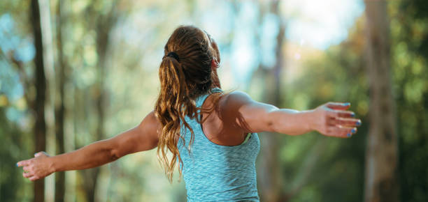 istock Open arms. Woman Exercising Outdoors in The Fall 1168579889