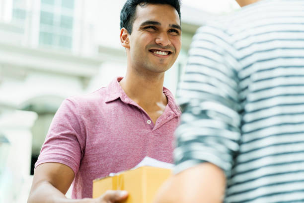 istock delivery ideas concept indian messenger handle package product to customer with happiness and cheerful house door entrance 1168580859