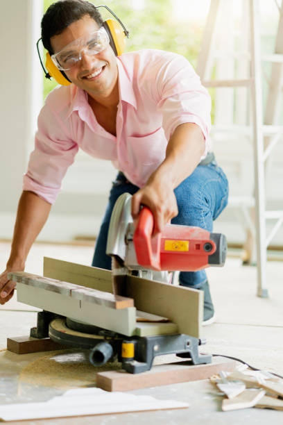 istock smart indian contractor hand use sawing machine wood work house renovation background home improvement ideas concept 1168580983