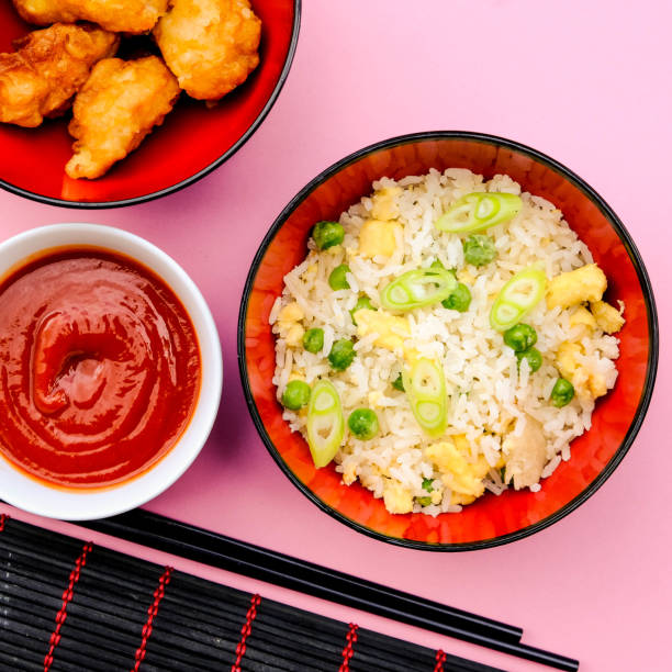 istock Chinese Style Sweet and Sour Fried Chicken With Egg Fried Rice 1168581250