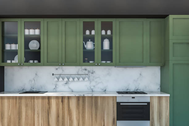 istock Green and gray kitchen with wooden countertops 1168582540