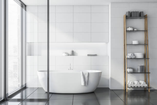 istock White tile bathroom interior with tub 1168582583