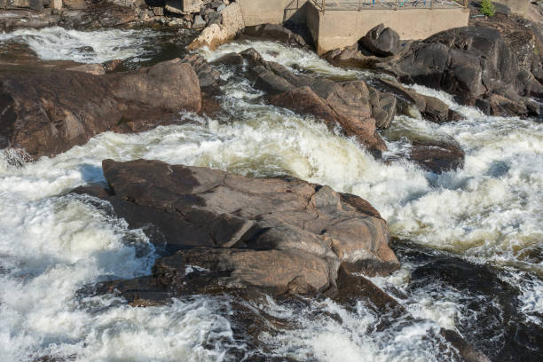 istock Rushing streams of water rush between large stones 1168582677
