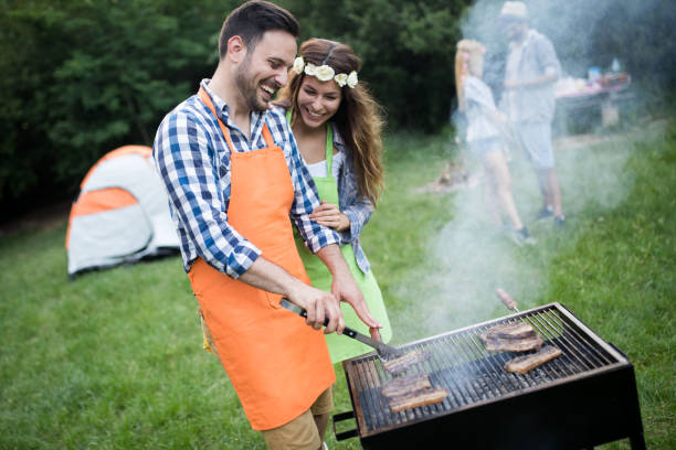 istock Friends having a barbecue party in nature 1168586845