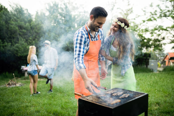 istock Group of friends having fun in nature doing bbq 1168586856