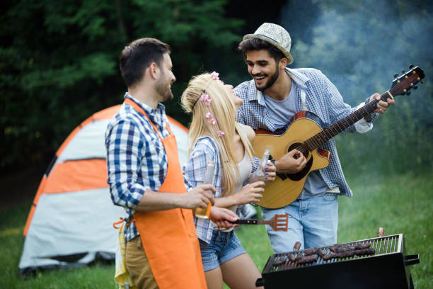 istock Friends having a barbecue party in nature 1168587636