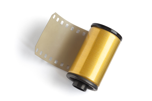 camera film, film canister, film negative, film reel, negative image technique, single object,
