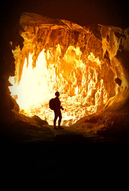 istock Silhouette Woman Standing In Cave 1168594883